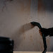 PUDU SH1 handheld accessory cleaning a splattered vertical wall