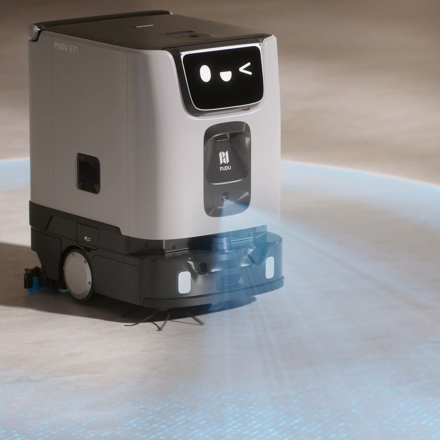 PUDU ET1 compact scrubber dryer robot scrubbing a hard floor in a retail space
