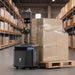 PUDU MP2000 autonomous pallet handling robot lifting a loaded pallet in a warehouse aisle