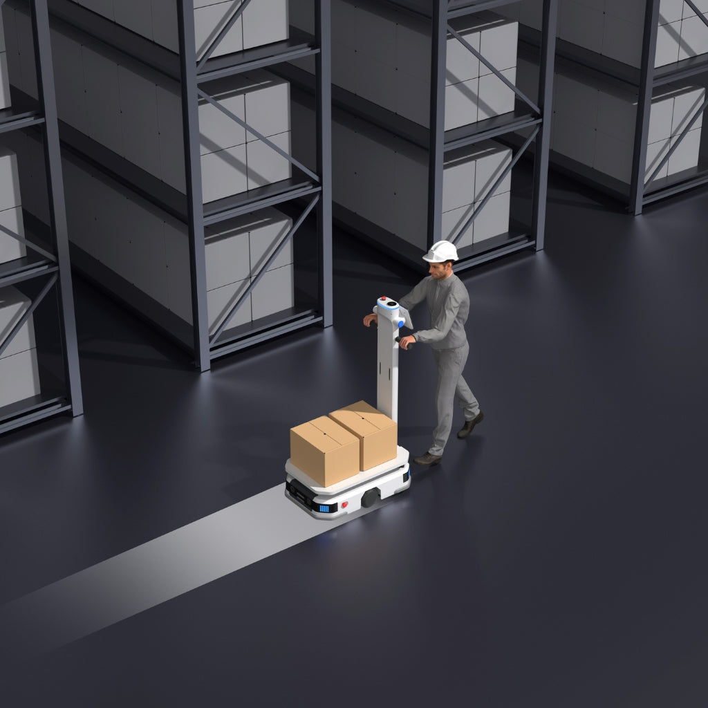 Warehouse worker using PUDU T300 in power-assist mode for easy manual manoeuvring of heavy loads.