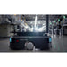 PUDU T300 industrial robot displaying green safety indicators and sensors while navigating a factory floor.