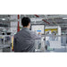 Factory worker using a remote workstation monitor to call and dispatch the PUDU T300 robot to their location.