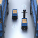 Two PUDU T600 robots passing each other smoothly in a warehouse aisle using VDA5050 coordination.