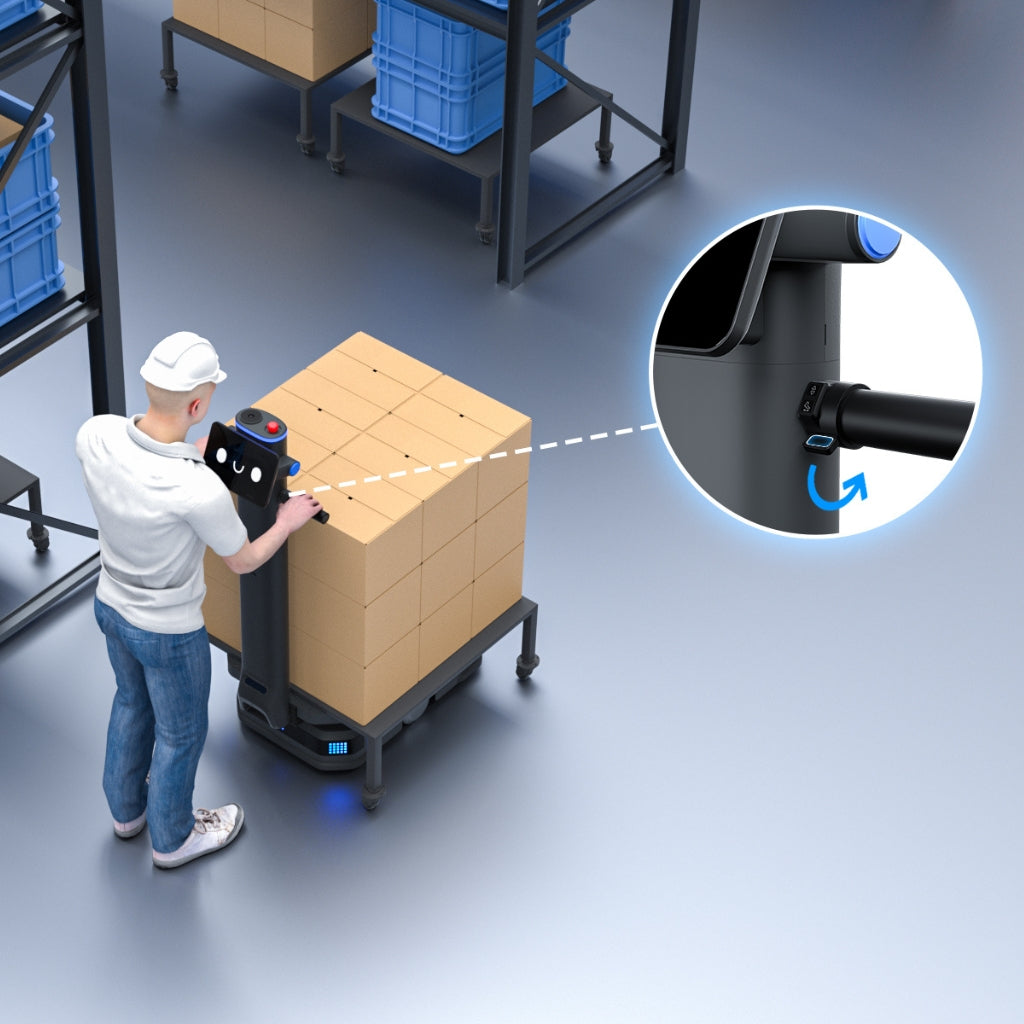 Warehouse worker using the PUDU T600 Power Assist mode to easily push and manoeuvre the robot manually.